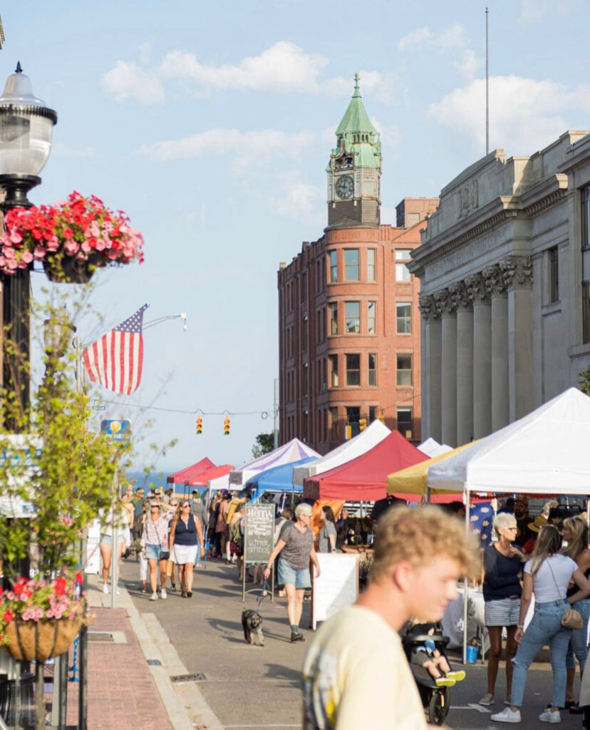 Downtown street in Marquette with tents for Marquette farmer’s market.